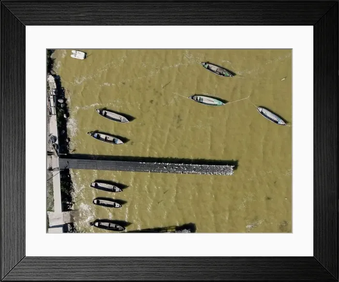 Framed Print : Fishing boats in a small village in Dobrogea, Romania. Aerial view Framed Print : Fishing boats in a small village in Dobrogea, Romania. Aerial view