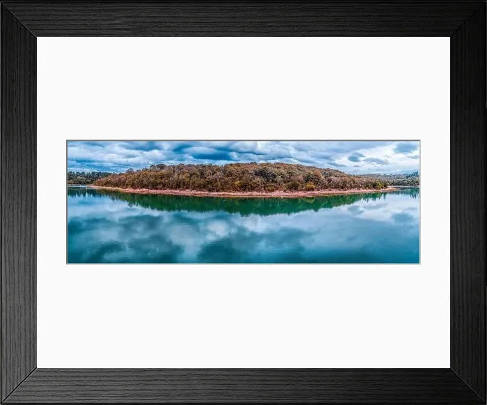 Framed Print : Wide beautiful panorama of trees growing on lakeshore with scenic clouds reflections in the water Framed Print : Wide beautiful panorama of trees growing on lakeshore with scenic clouds reflections in the water