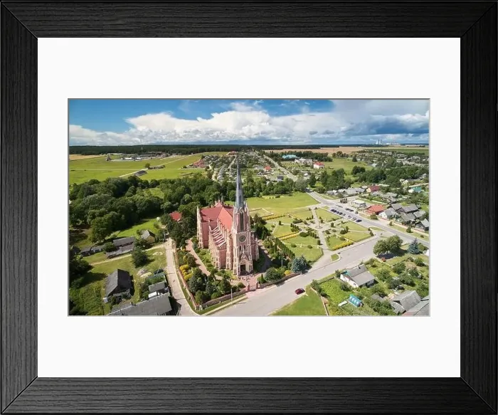 Framed Print : Catholic historical cathedral in small town aerial drone view Framed Print : Catholic historical cathedral in small town aerial drone view