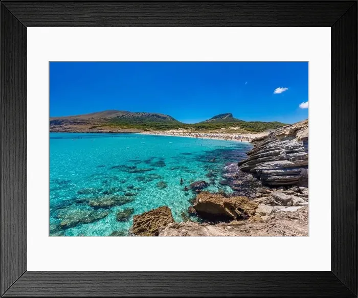 Framed Print : CALA MESQUIDA, MALLORCA, SPAIN - 19 July 2020: People enjoying beautiful sandy beach of on Mallorca Framed Print : CALA MESQUIDA, MALLORCA, SPAIN - 19 July 2020: People enjoying beautiful sandy beach of on Mallorca