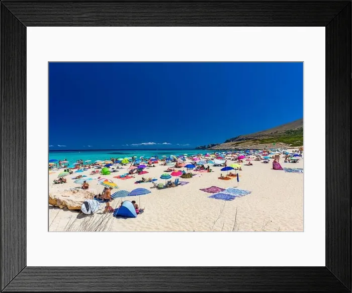 Framed Print : CALA MESQUIDA, MALLORCA, SPAIN - 19 July 2020: People enjoying beautiful sandy beach of on Mallorca Framed Print : CALA MESQUIDA, MALLORCA, SPAIN - 19 July 2020: People enjoying beautiful sandy beach of on Mallorca