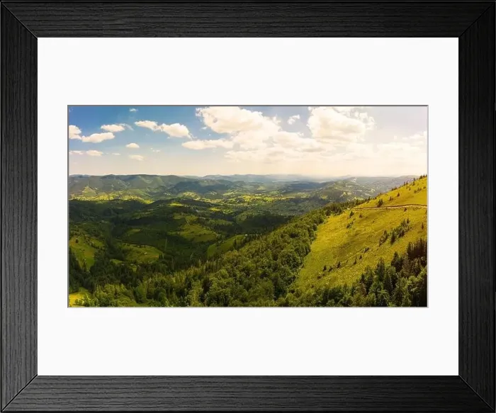 Framed Print : Aerial drone view of picturesque nature with green coniferous forests on the slopes of the mountains in beautiful sunny Framed Print : Aerial drone view of picturesque nature with green coniferous forests on the slopes of the mountains in beautiful sunny