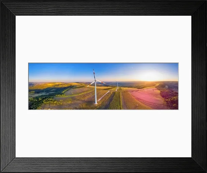 Framed Print : Panorama of wind turbine in a windfarm on hills in Moldova at sunset, aerial drone view with glowing sun Framed Print : Panorama of wind turbine in a windfarm on hills in Moldova at sunset, aerial drone view with glowing sun