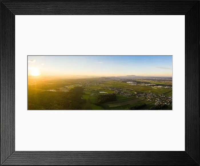 Framed Print : Aerial view of agriculture fields and green alpine forest in Austria Framed Print : Aerial view of agriculture fields and green alpine forest in Austria