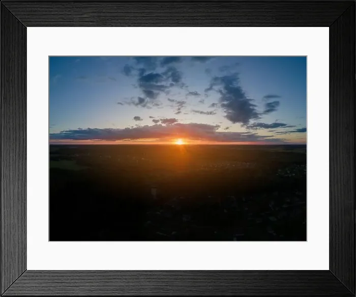 Framed Print : View from drone, panorama orange sky and gray clouds, sun at sunset Framed Print : View from drone, panorama orange sky and gray clouds, sun at sunset