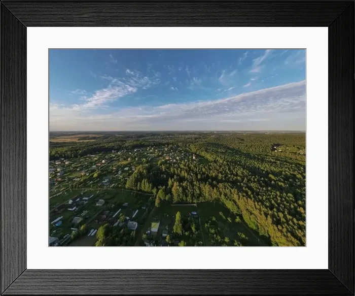 Framed Print : High View from the height of a flying drone, a small village with houses and cottages, green fields on a summer day Framed Print : High View from the height of a flying drone, a small village with houses and cottages, green fields on a summer day