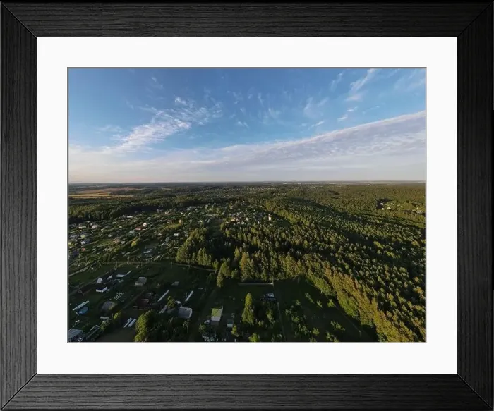 Framed Print : High View from the height of a flying drone, a small village with houses and cottages, green fields on a summer day Framed Print : High View from the height of a flying drone, a small village with houses and cottages, green fields on a summer day