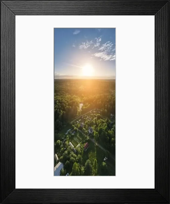 Framed Print : High View from the height of a flying drone, a small village with houses and cottages, green fields on a summer day Framed Print : High View from the height of a flying drone, a small village with houses and cottages, green fields on a summer day