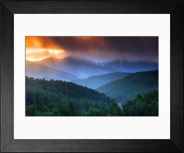 Framed Print : Majestic drone view of bright sun setting on cloudy evening sky over green hilly terrain Framed Print : Majestic drone view of bright sun setting on cloudy evening sky over green hilly terrain