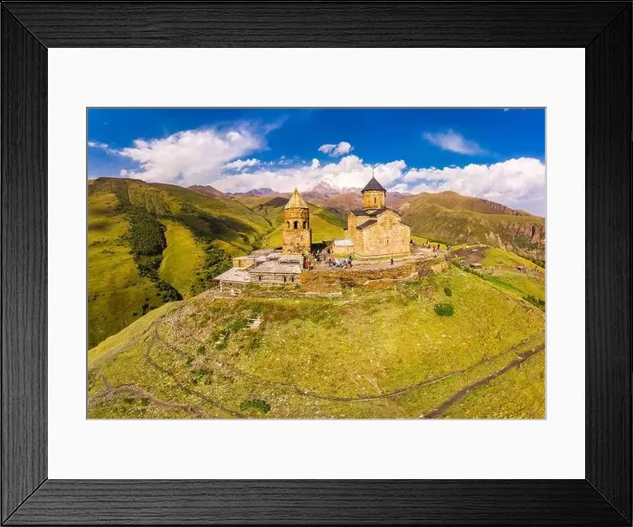 Framed Print : Beautiful Top view from drone to Tsminda Sameba or Holy Trinity Church Near Village Of Gergeti In Georgia Framed Print : Beautiful Top view from drone to Tsminda Sameba or Holy Trinity Church Near Village Of Gergeti In Georgia