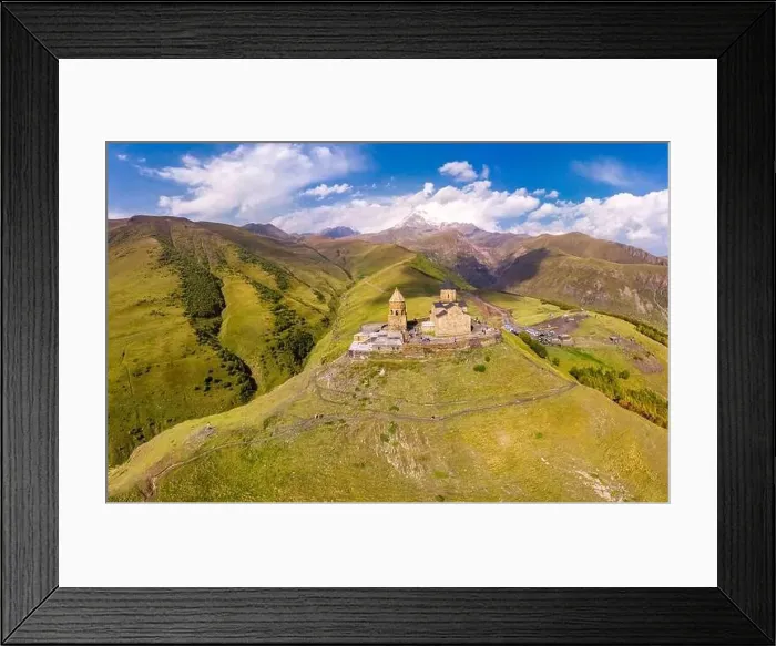 Framed Print : Beautiful Top view from drone to Tsminda Sameba or Holy Trinity Church Near Village Of Gergeti In Georgia Framed Print : Beautiful Top view from drone to Tsminda Sameba or Holy Trinity Church Near Village Of Gergeti In Georgia