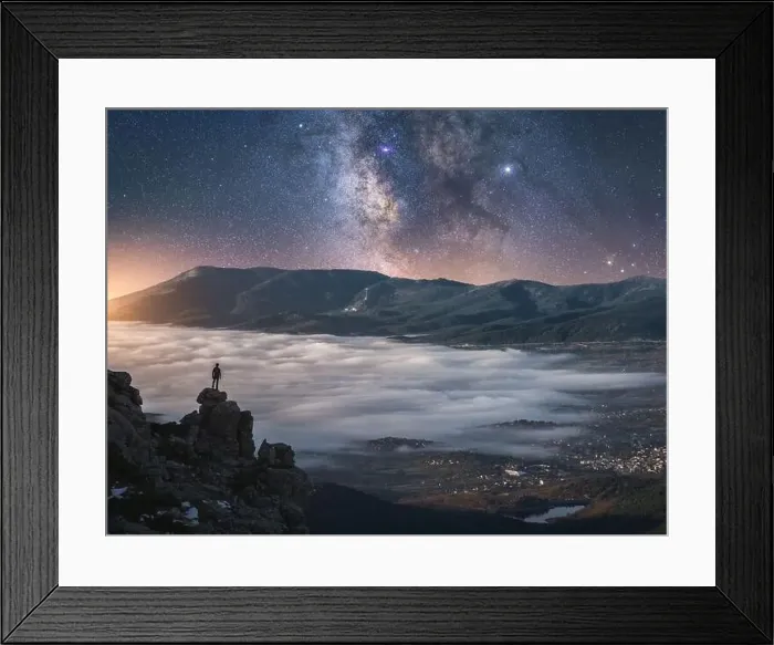 Framed Print : Drone view of traveler watching sunrise while standing on cliff Framed Print : Drone view of traveler watching sunrise while standing on cliff