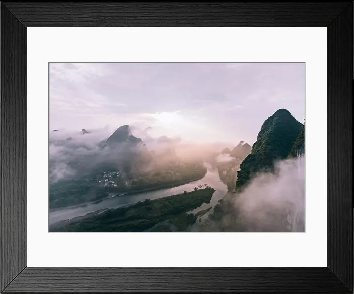 Framed Print : Mysterious river landscape among high mountains in haze Framed Print : Mysterious river landscape among high mountains in haze