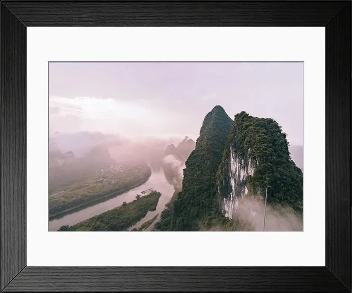 Framed Print : Mysterious river landscape among high mountains in haze Framed Print : Mysterious river landscape among high mountains in haze