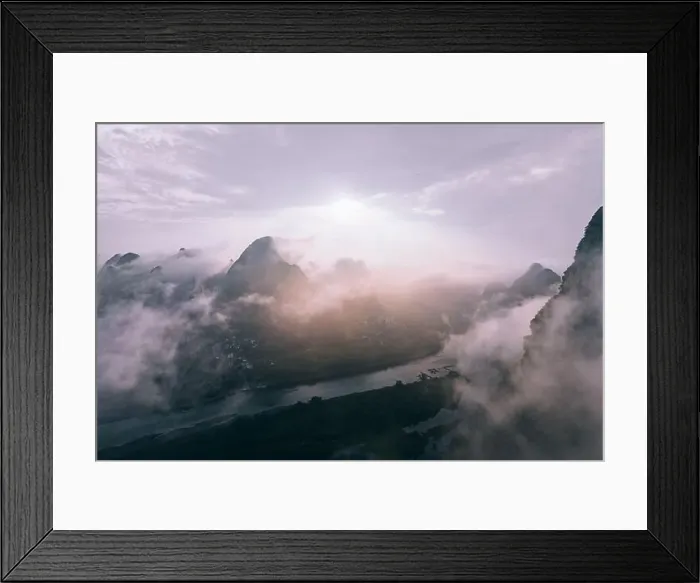 Framed Print : Mysterious river landscape among high mountains in haze Framed Print : Mysterious river landscape among high mountains in haze