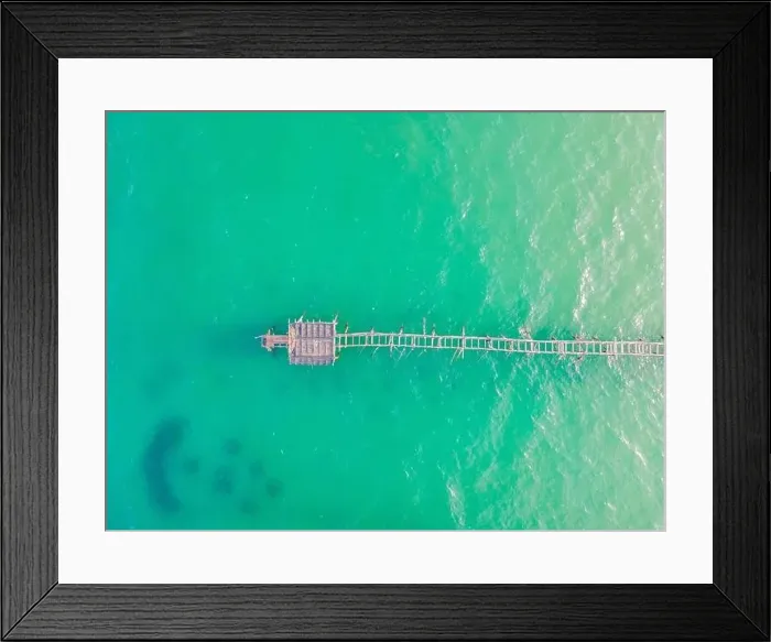Framed Print : Turquoise water and concrete jetty pier, drone shot Framed Print : Turquoise water and concrete jetty pier, drone shot