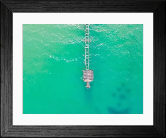 Framed Print : Turquoise water and concrete jetty pier, drone shot Framed Print : Turquoise water and concrete jetty pier, drone shot