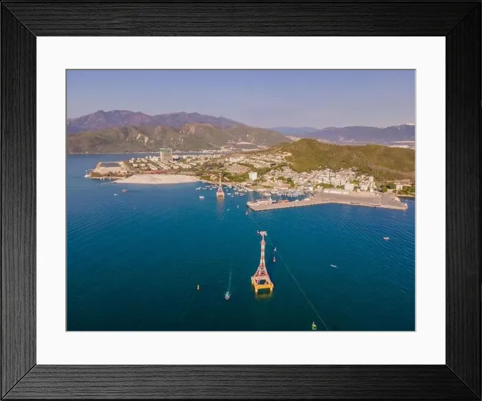 Framed Print : The cable car at Nha Trang beach. Aerial view from drone Framed Print : The cable car at Nha Trang beach. Aerial view from drone