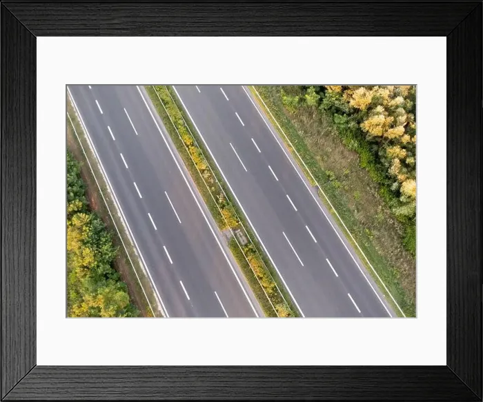 Framed Print : two lane road from above with no cars Framed Print : two lane road from above with no cars