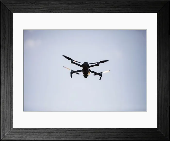 Framed Print : Color image of a drone flying at sunrise Framed Print : Color image of a drone flying at sunrise