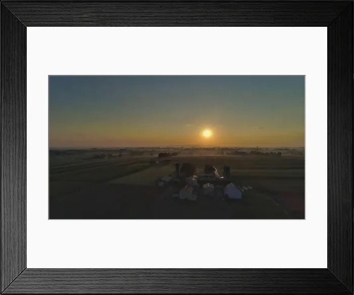 Framed Print : Sunrise over barns, silos and green farmlands with blue, red and orange skies and a few clouds with a mist on the ground Framed Print : Sunrise over barns, silos and green farmlands with blue, red and orange skies and a few clouds with a mist on the ground