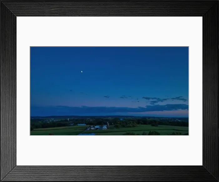 Framed Print : Sunset over barns, silos and green farmlands with blue, red and orange skies and a few clouds Framed Print : Sunset over barns, silos and green farmlands with blue, red and orange skies and a few clouds