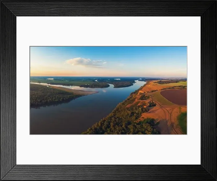 Framed Print : Aerial drone view of river landscape in sunny summer evening Framed Print : Aerial drone view of river landscape in sunny summer evening