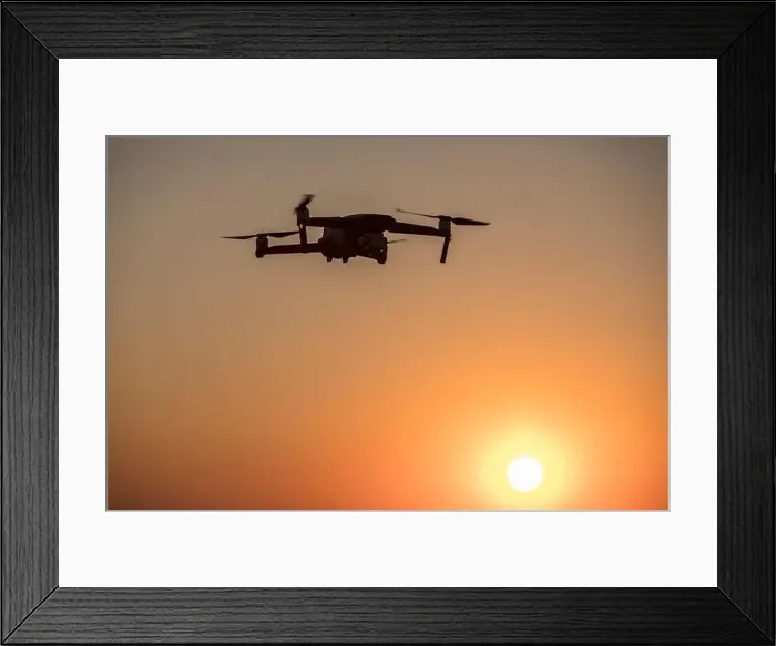 Framed Print : Color image of a drone flying at sunrise Framed Print : Color image of a drone flying at sunrise
