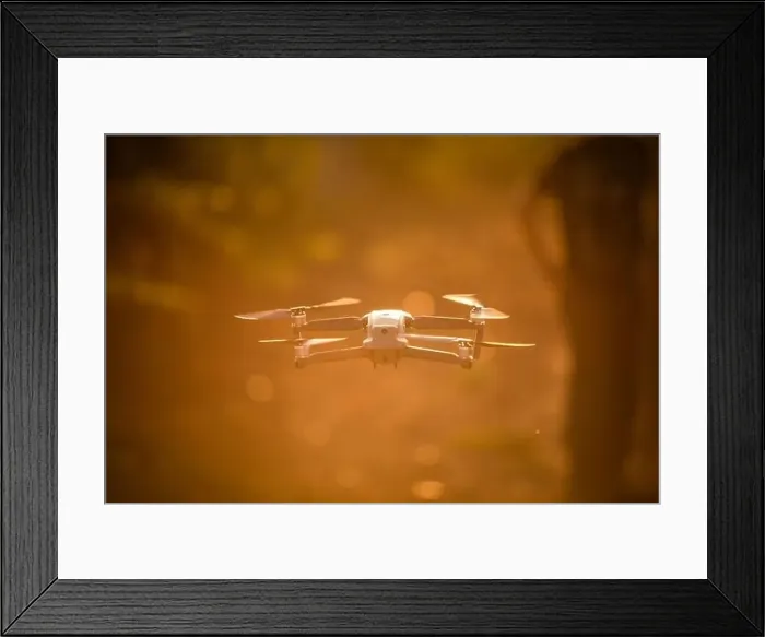 Framed Print : Color image of a drone flying at sunrise Framed Print : Color image of a drone flying at sunrise