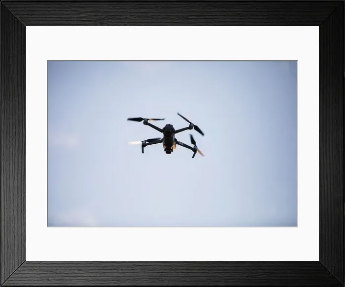 Framed Print : Color image of a drone flying at sunrise Framed Print : Color image of a drone flying at sunrise