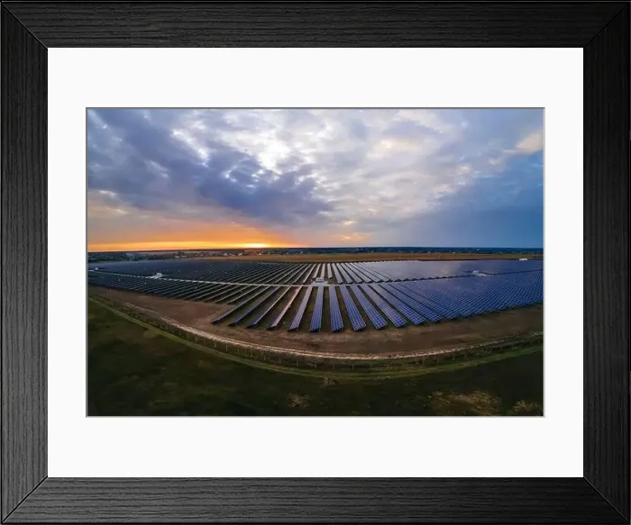Framed Print : Aerial panorama view of large solar panels at a solar farm at bright summer sunset Framed Print : Aerial panorama view of large solar panels at a solar farm at bright summer sunset