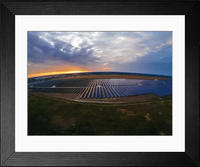 Framed Print : Aerial panorama view of large solar panels at a solar farm at bright summer sunset Framed Print : Aerial panorama view of large solar panels at a solar farm at bright summer sunset