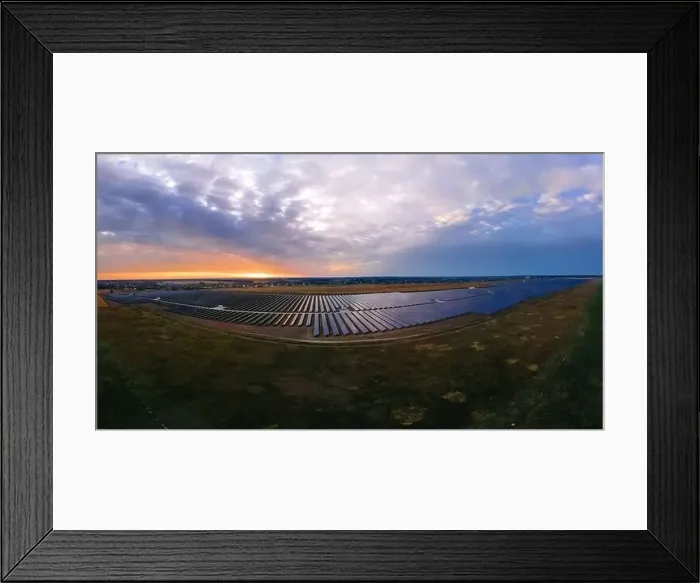 Framed Print : Aerial panorama view of large solar panels at a solar farm at bright summer sunset Framed Print : Aerial panorama view of large solar panels at a solar farm at bright summer sunset