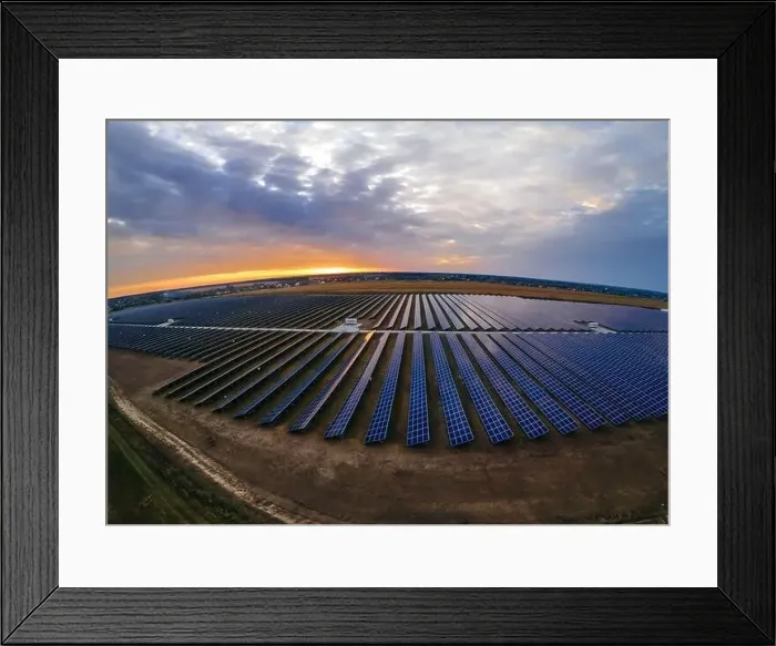 Framed Print : Aerial panorama view of large solar panels at a solar farm at bright summer sunset Framed Print : Aerial panorama view of large solar panels at a solar farm at bright summer sunset