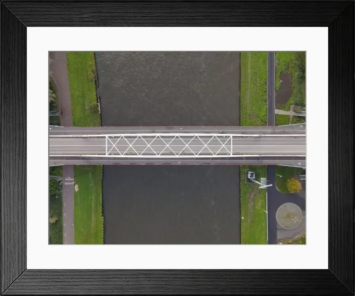 Framed Print : Aerial view of a bridge over a river with a water way river running underneath Framed Print : Aerial view of a bridge over a river with a water way river running underneath