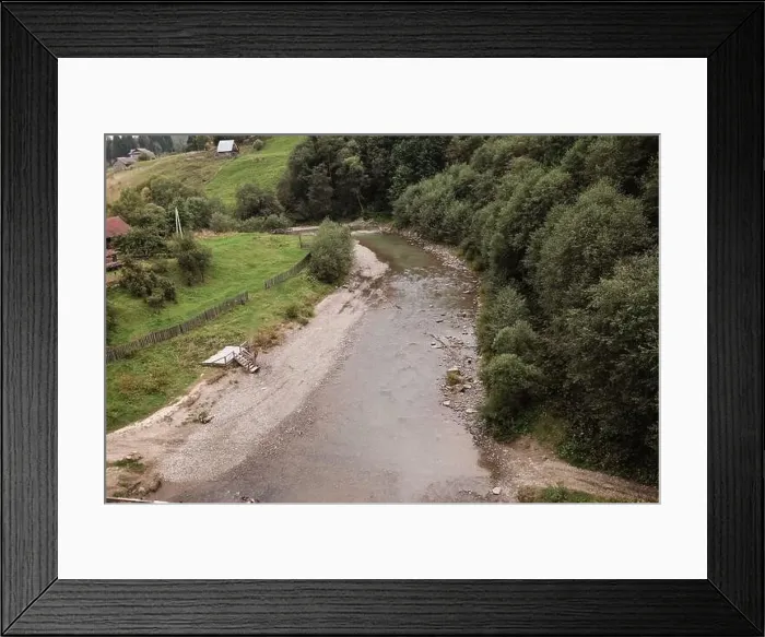 Framed Print : Top view of a mountain river. mountain river flowing near the settlement Framed Print : Top view of a mountain river. mountain river flowing near the settlement