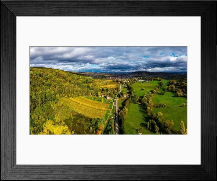 Framed Print : A drone rises above a multi-colored valley in the Vosges Framed Print : A drone rises above a multi-colored valley in the Vosges