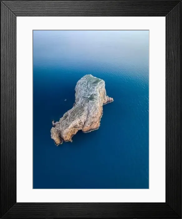 Framed Print : Aerial view of Isola Foradada island in front of the rocky promontory of Capo Caccia at sunset Framed Print : Aerial view of Isola Foradada island in front of the rocky promontory of Capo Caccia at sunset