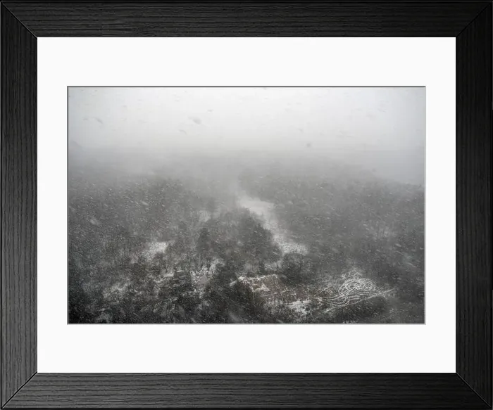 Framed Print : Snow storm in the forest over a destroyed wooden house, top view. Blizzard in the winter park Framed Print : Snow storm in the forest over a destroyed wooden house, top view. Blizzard in the winter park
