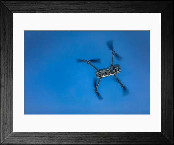 Framed Print : Drone flying drone on a blurry background of nature Framed Print : Drone flying drone on a blurry background of nature
