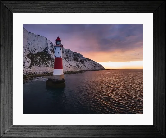 Framed Print : Aerial Drone Landscape photo of a Beachy Head Lighthouse and chalk cliffs at colorful sunrise with low tide in England