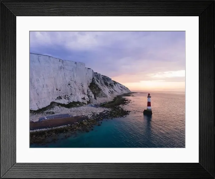 Framed Print : Aerial Drone Landscape photo of a Beachy Head Lighthouse and chalk cliffs at colorful sunrise with low tide in England Framed Print : Aerial Drone Landscape photo of a Beachy Head Lighthouse and chalk cliffs at colorful sunrise with low tide in England
