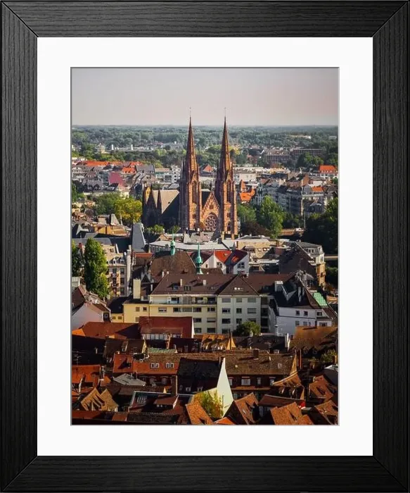 Framed Print : Aerial view of the city of Strasbourg. Sunny day. Red tiled roofs. Small, like the toy houses of the old city Framed Print : Aerial view of the city of Strasbourg. Sunny day. Red tiled roofs. Small, like the toy houses of the old city