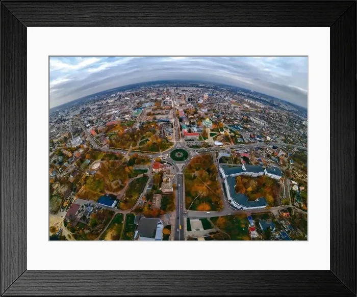 Framed Print : Aerial panoramic view of roundabout road with circular cars in small european city at cloudy autumn day Framed Print : Aerial panoramic view of roundabout road with circular cars in small european city at cloudy autumn day