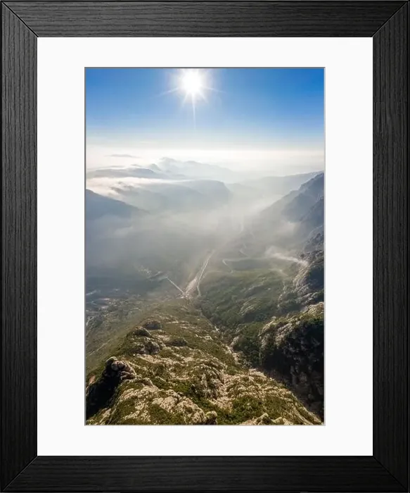 Framed Print : aerial drone shot of highway through Montserrat mountain near Barcelona with morning fog Framed Print : aerial drone shot of highway through Montserrat mountain near Barcelona with morning fog