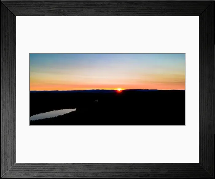 Framed Print : Sunset over the hills in a boreal wild forest in Scandinavia.. High quality photo