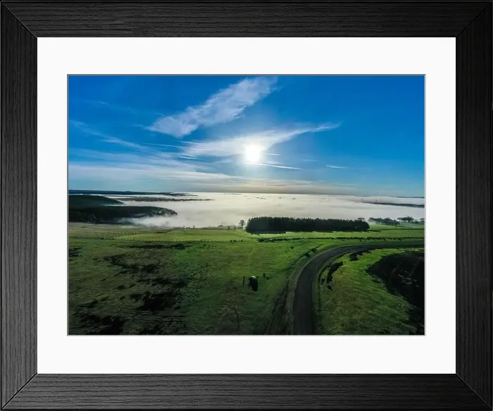 Framed Print : Beautiful morning of drone footage overlooking welsh sceneray with fog sheet covering the lower valleys in south wales Framed Print : Beautiful morning of drone footage overlooking welsh sceneray with fog sheet covering the lower valleys in south wales