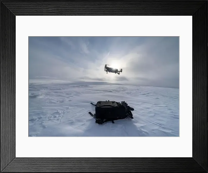 Framed Print : Drone flying into winter sun over the snowy hills of Urho Kekkonen National Park, Saariselka, Inari, Lapland, Finland