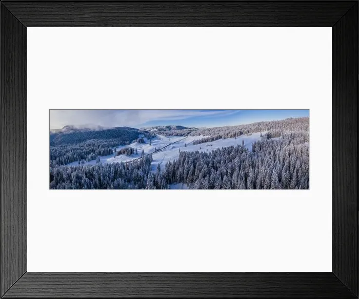 Framed Print : Stunning winter scene landscape of snow covered trees and forest as a road cuts through the landscape Framed Print : Stunning winter scene landscape of snow covered trees and forest as a road cuts through the landscape