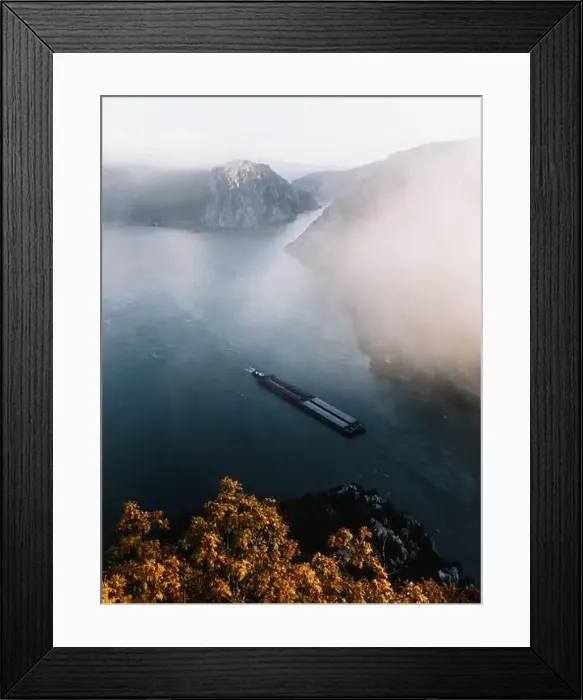 Framed Print : Majestic Foggy autumn landscape with cargo ship on water at sunrise Framed Print : Majestic Foggy autumn landscape with cargo ship on water at sunrise